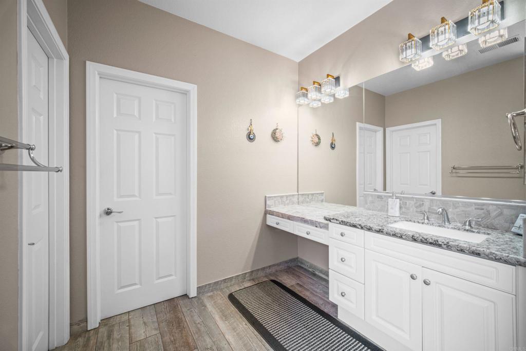 2781 Rambling Vista Road Chula Vista, CA 91915 - Photo 24 of 50 a bathroom with a granite countertop sink and a mirror