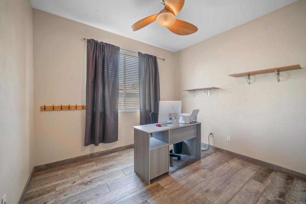 2781 Rambling Vista Road Chula Vista, CA 91915 - Photo 26 of 50 a view of a room with wooden floor and windows