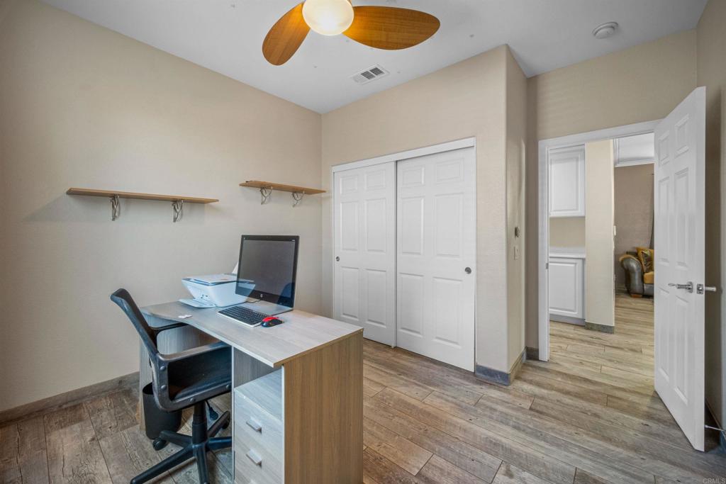 2781 Rambling Vista Road Chula Vista, CA 91915 - Photo 27 of 50 a workspace with furniture and wooden floor