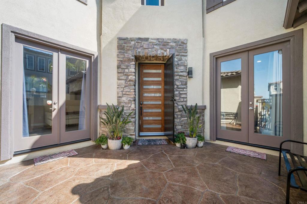 2781 Rambling Vista Road Chula Vista, CA 91915 - Photo 3 of 50 a view of a brick house with large windows and plants