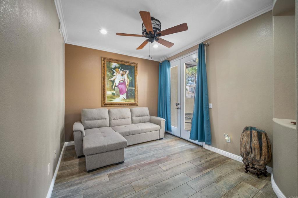2781 Rambling Vista Road Chula Vista, CA 91915 - Photo 35 of 50 a living room with furniture a ceiling fan and a rug