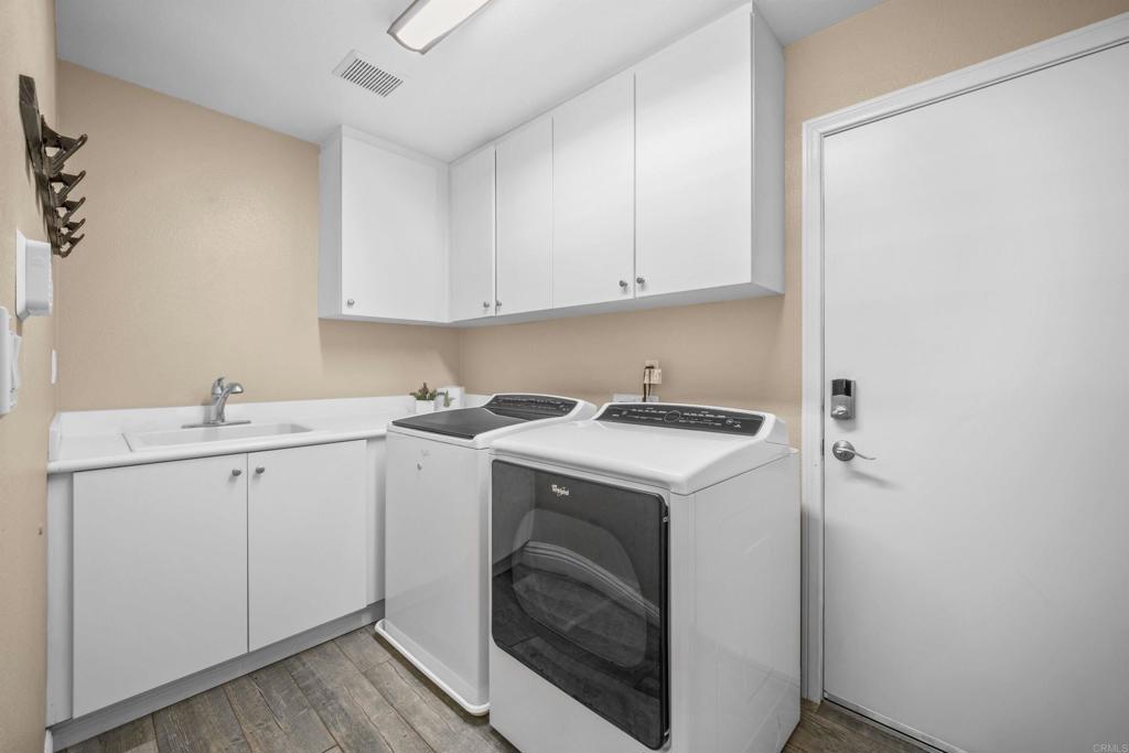 2781 Rambling Vista Road Chula Vista, CA 91915 - Photo 36 of 50 a utility room with sink dryer and washer