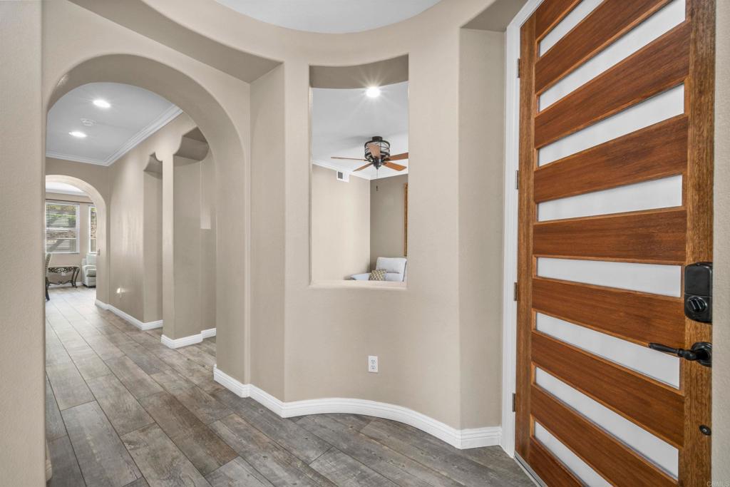 2781 Rambling Vista Road Chula Vista, CA 91915 - Photo 4 of 50 a view of a hallway with wooden floor and staircase