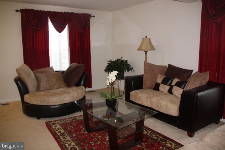 1256 Steed Street Ranson, WV 25438 - Photo 13 of 16 a living room with furniture and a window