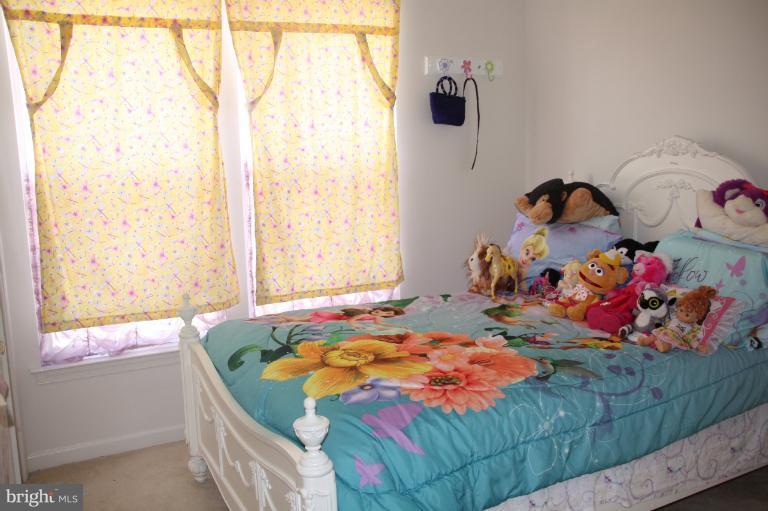 1256 Steed Street Ranson, WV 25438 - Photo 14 of 16 a bedroom with a bed and a window