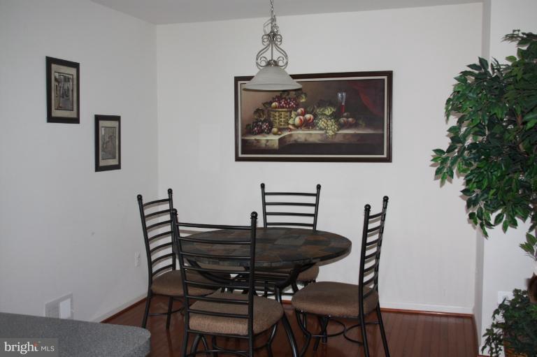 1256 Steed Street Ranson, WV 25438 - Photo 5 of 16 a view of a dining room with furniture and wooden floor