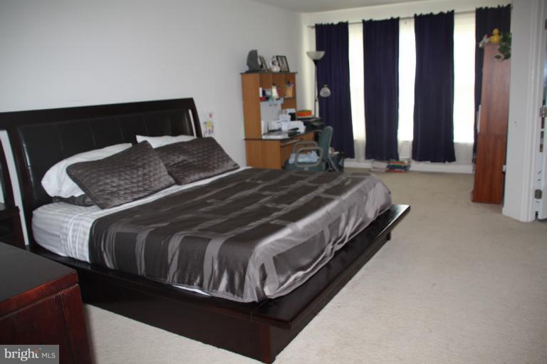 1256 Steed Street Ranson, WV 25438 - Photo 7 of 16 a bedroom with a bed and dresser
