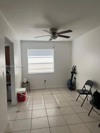 a room with gym equipment and a window