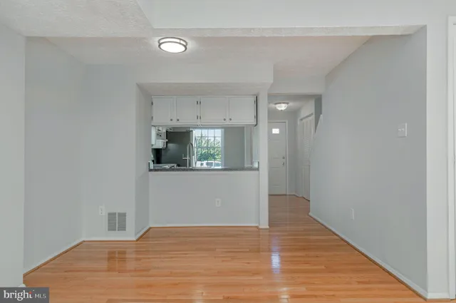 a view of a kitchen from the hallway