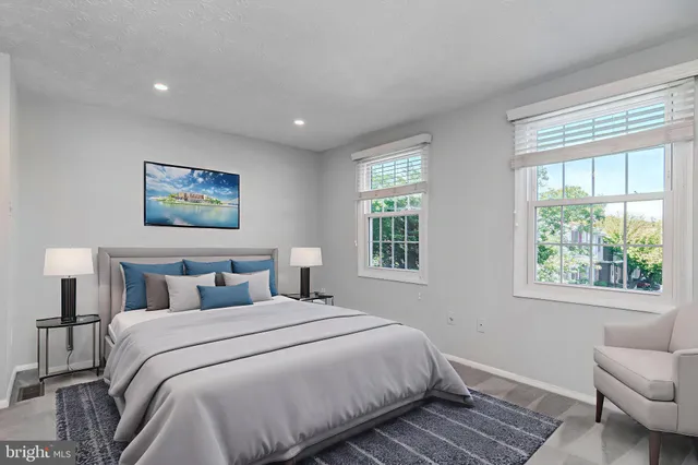 a bedroom with a large bed and a window