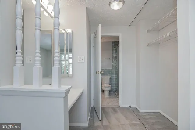 a bathroom with a mirror and a shower
