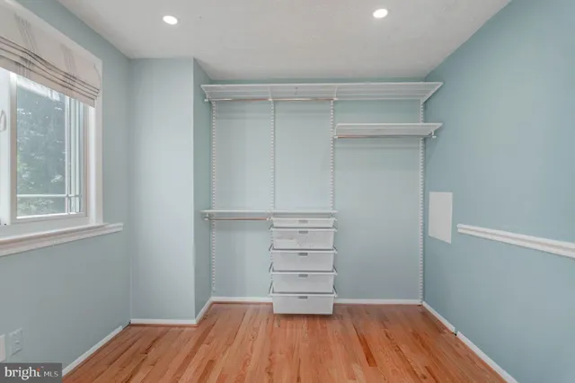 a room with a hardwood and a window