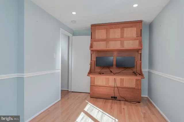 a room with a bed and a window