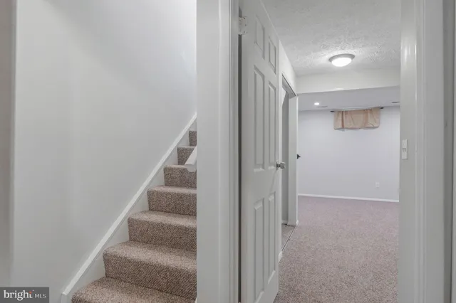 a view of staircase with white walls and white walls