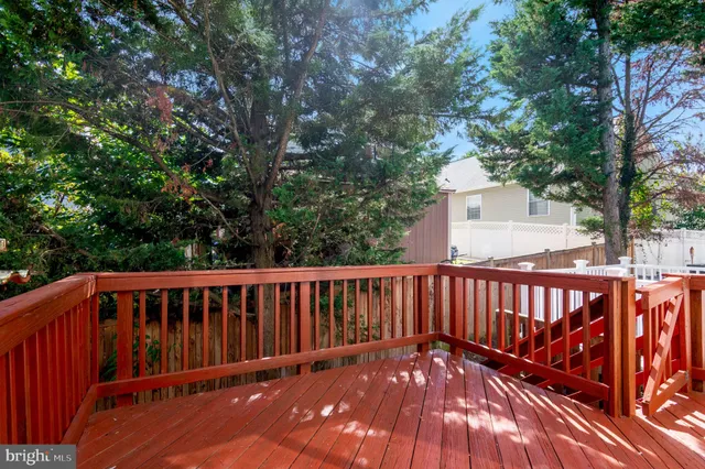 a view of deck with wooden floor and fence