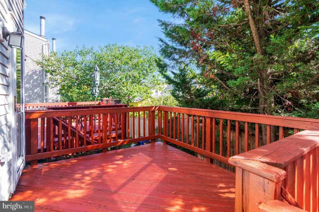 a view of small yard with wooden fence