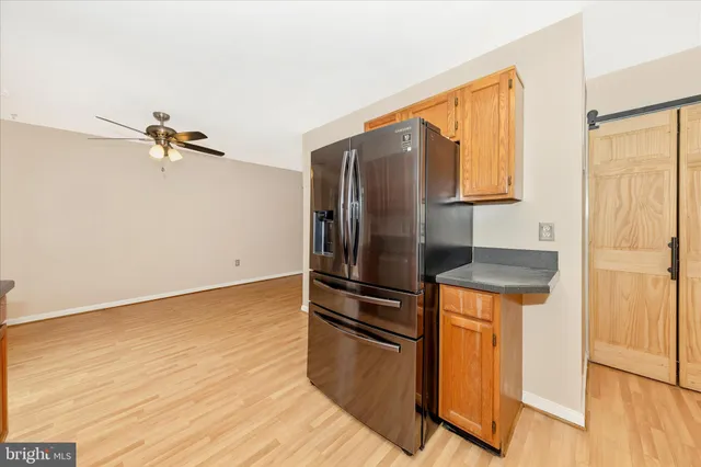 a kitchen with stainless steel appliances granite countertop a stove microwave and sink