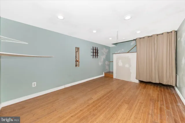 a view of balcony with wooden floor and fence