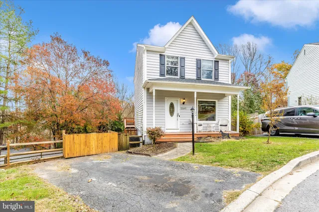 a view of balcony with wooden floor and fence