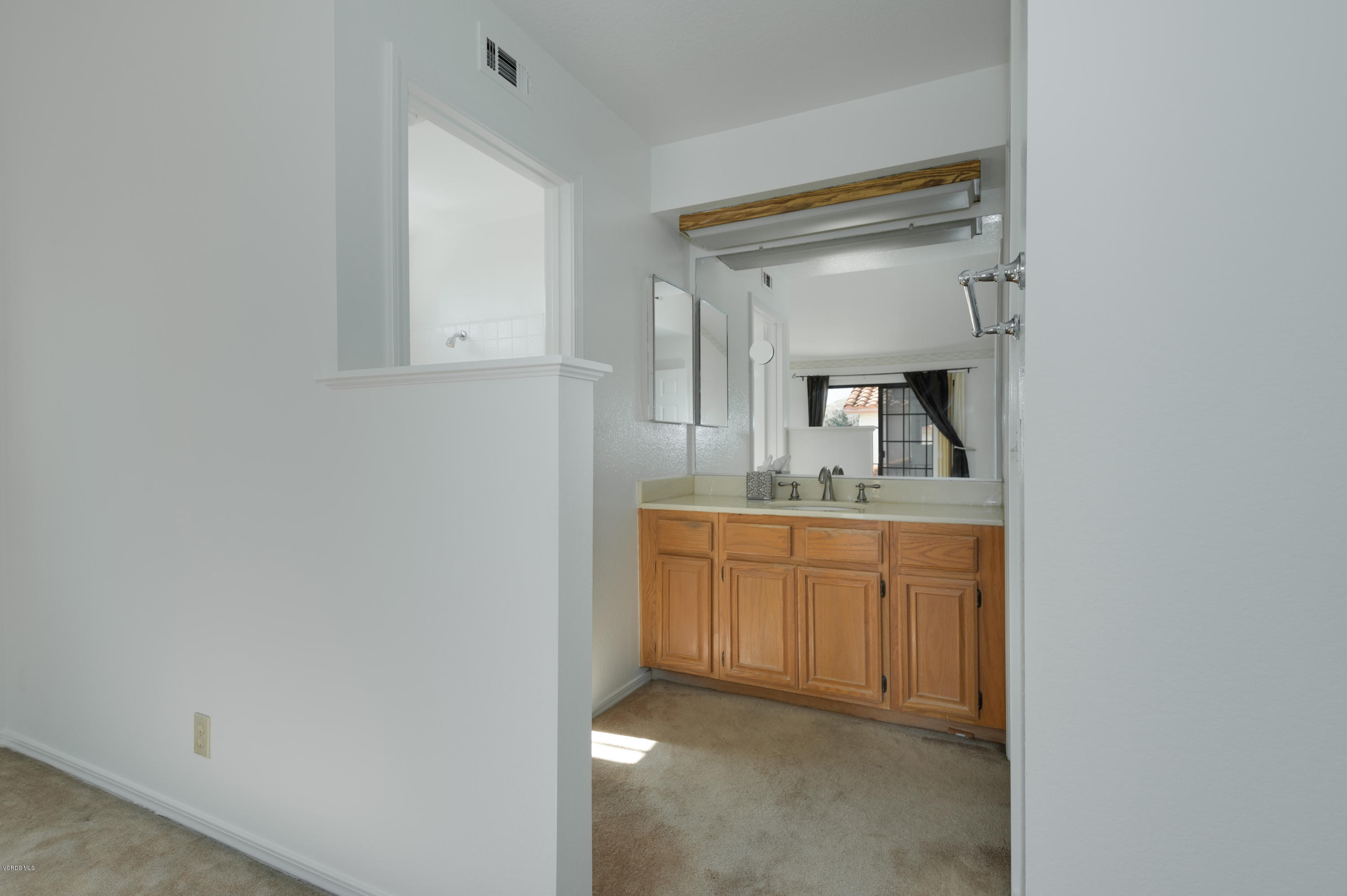 844 Congressional Road Simi Valley, CA 93065 - Photo 31 of 38 a bathroom with granite countertop a sink and a mirror