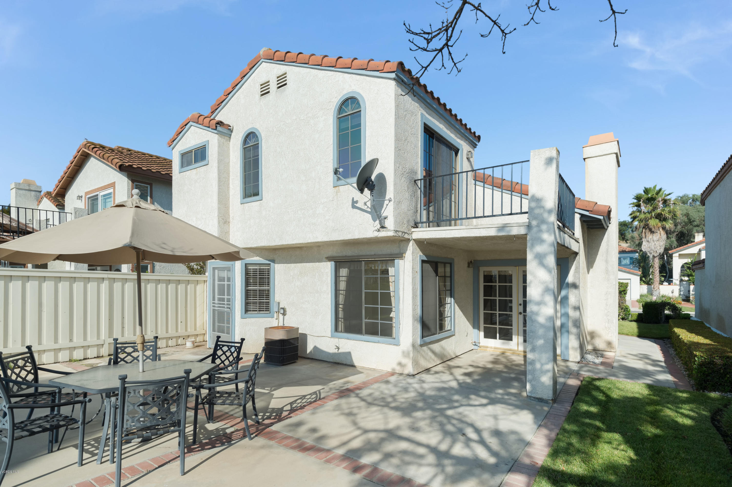 844 Congressional Road Simi Valley, CA 93065 - Photo 36 of 38 a view of a white house with a chairs in patio