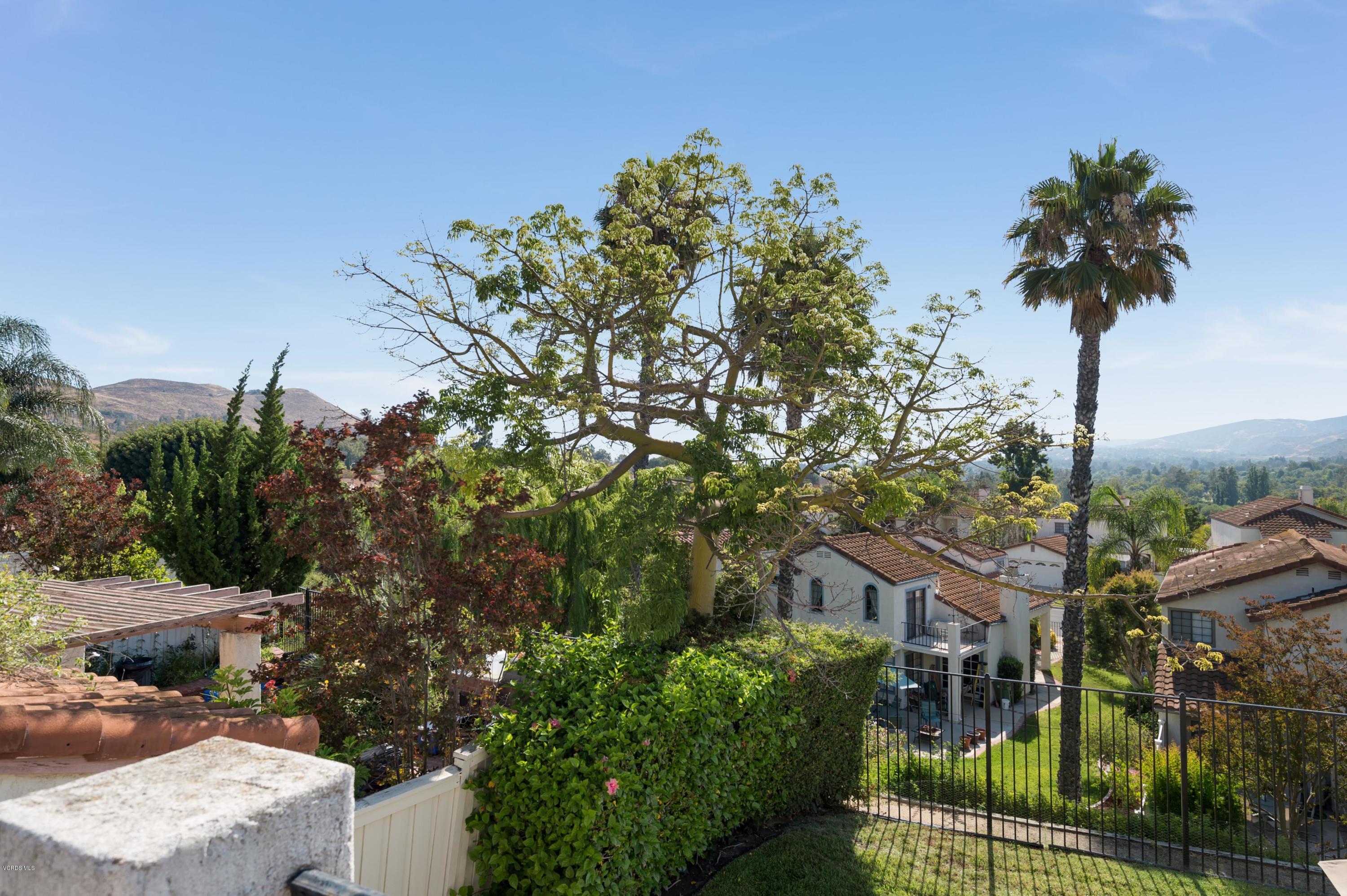 844 Congressional Road Simi Valley, CA 93065 - Photo 5 of 38 a front view of a house with a garden and tree