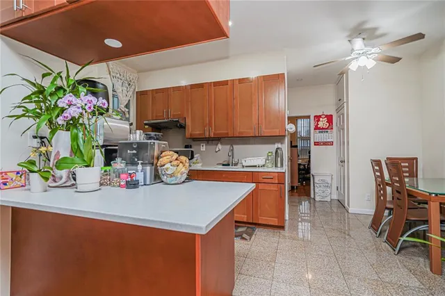 a kitchen with a table and chairs in it
