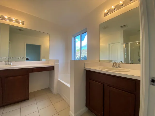 a huge green field with lots of trees