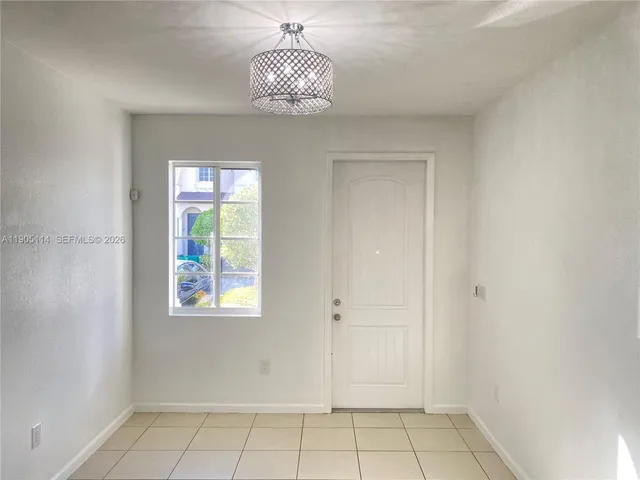 a view of entryway with kitchen