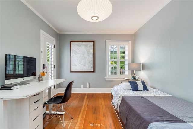 a workspace with furniture and wooden floor