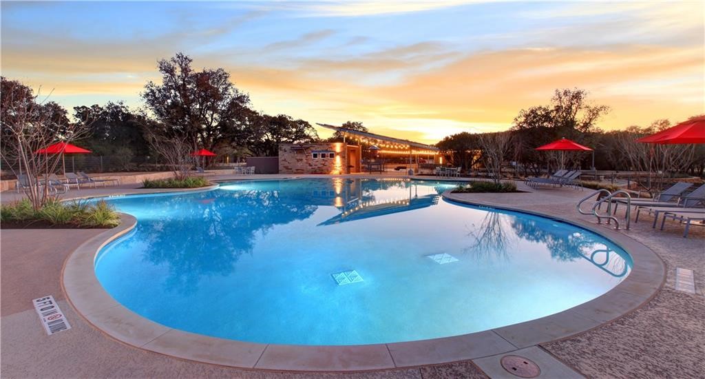 2233 Ringstaff Road Leander, TX 78641 - Photo 14 of 18 a view of a swimming pool with an outdoor seating