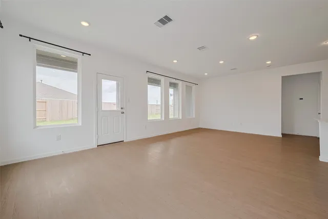 a view of an empty room with a window