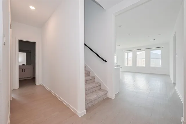 a view of a hallway with staircase