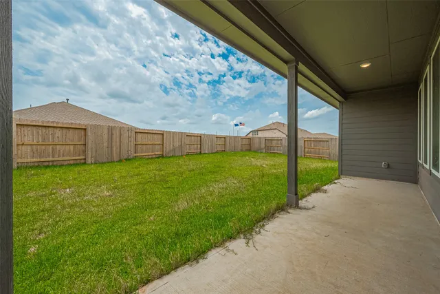 a house view with swimming pool in front of it