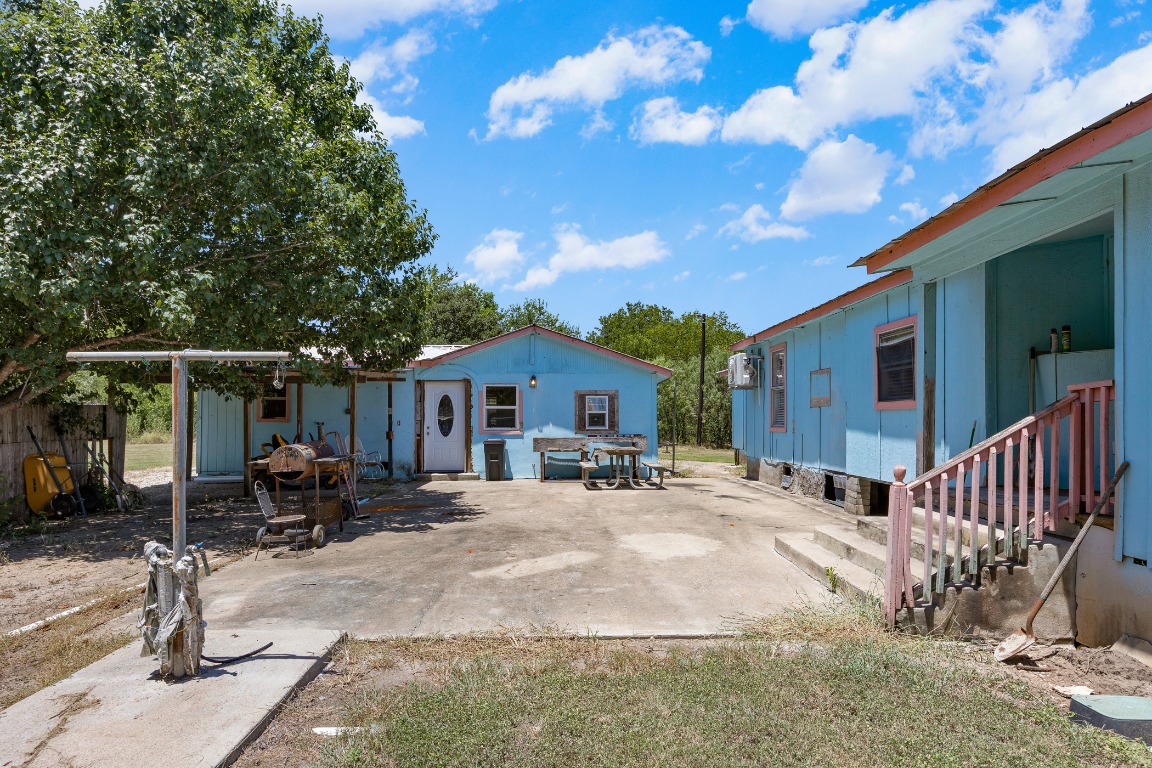 147 Community Center Road Rosanky, TX 78953 - Photo 21 of 33 a view of a house with a patio