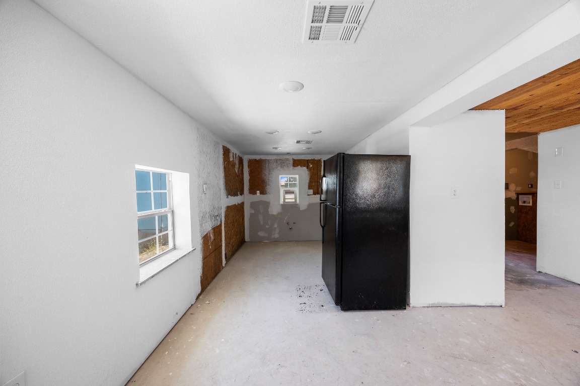 147 Community Center Road Rosanky, TX 78953 - Photo 25 of 33 a view of a hallway with wooden shelves