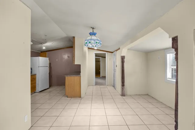 a kitchen with a stove a refrigerator and a sink