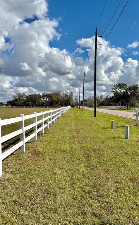 Singletary Road Myakka City, FL 34251 - Photo 3 of 6 a view of a swimming pool with a yard