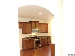 233 Lorraine Road Fort Mill, SC 29708 - Photo 4 of 16 a kitchen with a sink cabinets and stainless steel appliances