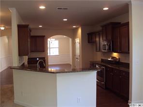 233 Lorraine Road Fort Mill, SC 29708 - Photo 8 of 16 a kitchen with granite countertop a sink stainless steel appliances and cabinets