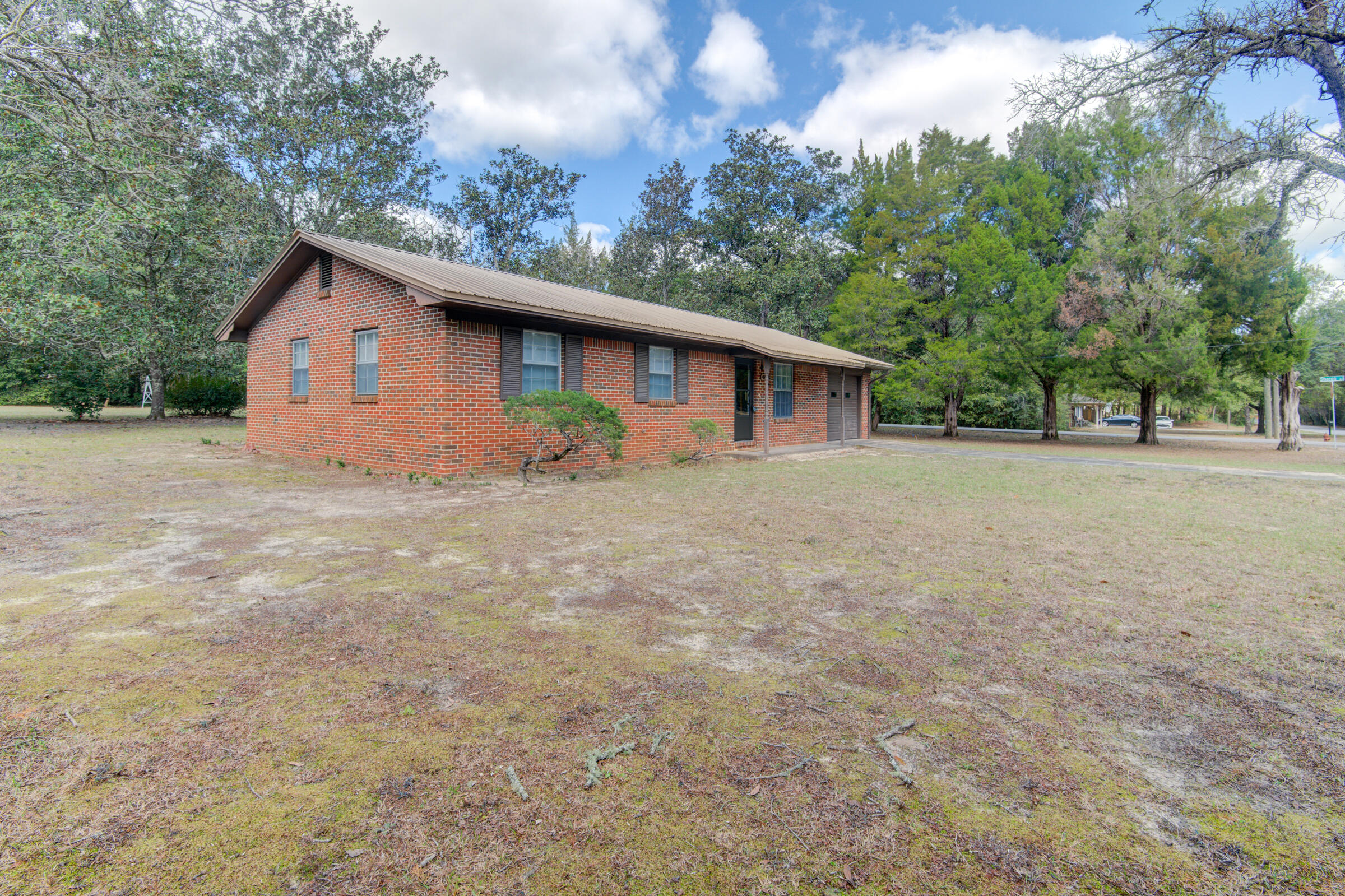 4826 Primrose Street Crestview, FL 32539 - Photo 11 of 25 a house with trees in the background