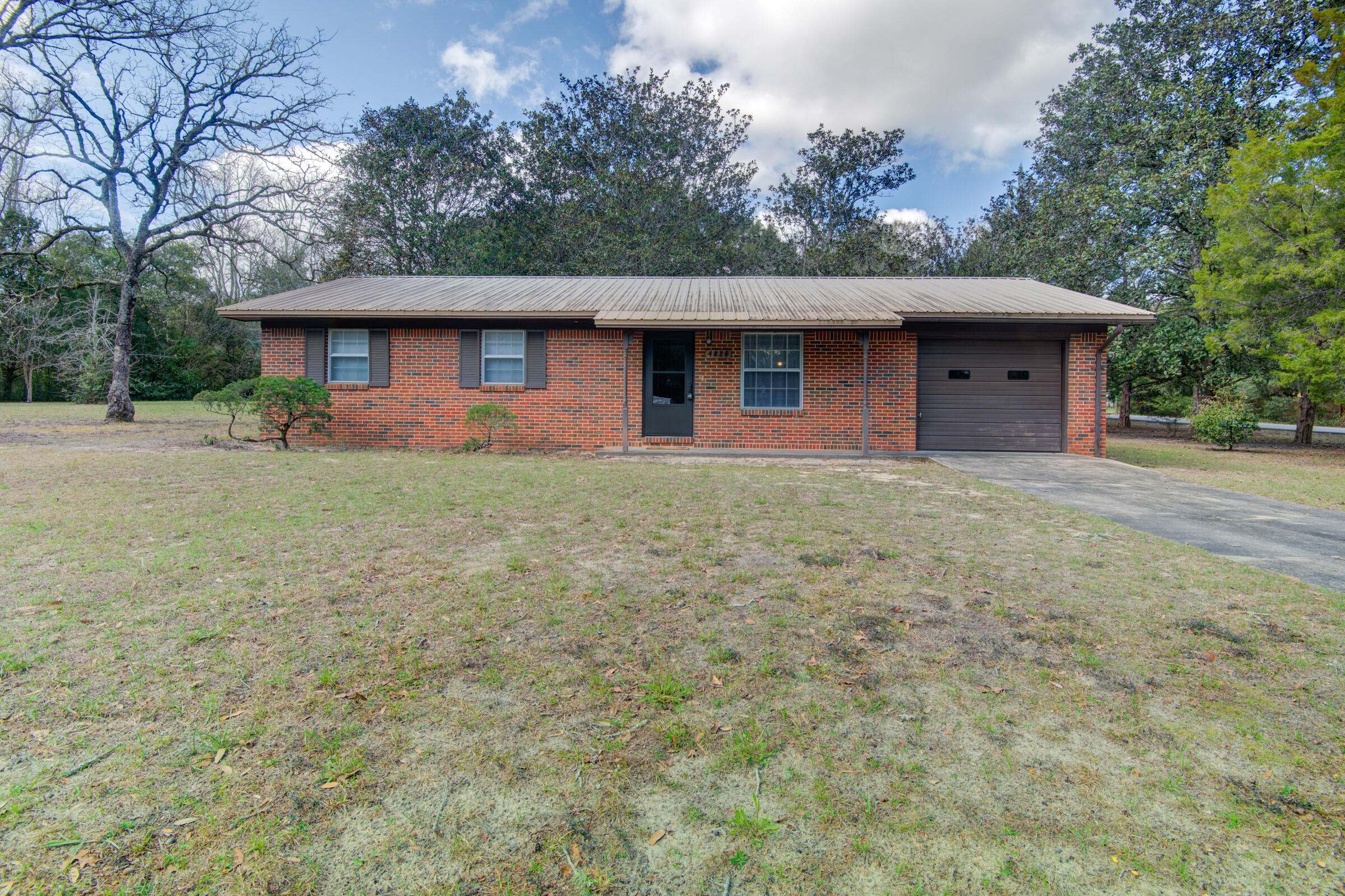 4826 Primrose Street Crestview, FL 32539 - Photo 2 of 25 a front view of a house with a yard