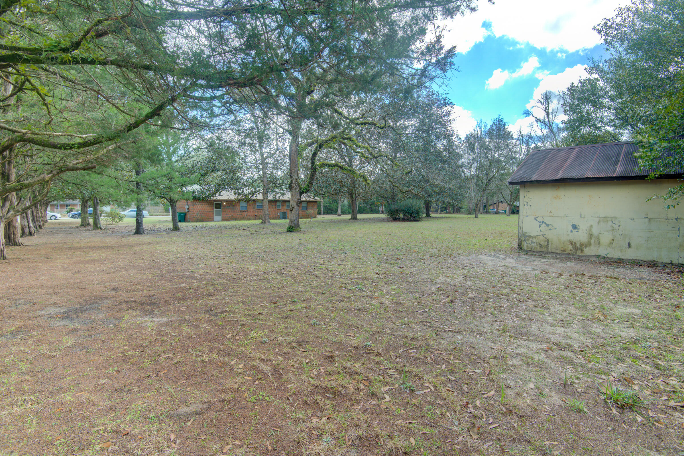 4826 Primrose Street Crestview, FL 32539 - Photo 9 of 25 a backyard of a house with barbeque oven