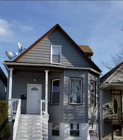 a front view of a house with glass windows