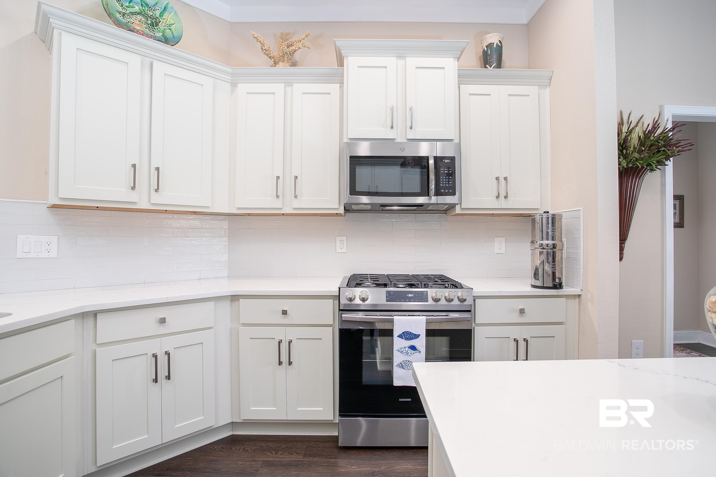 13154 Vincent Court Foley, AL 36535 - Photo 5 of 41 Kitchen with white cabinets, light countertops, and stainless steel appliances