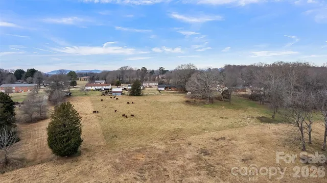 a view of yard covered with snow in front of house