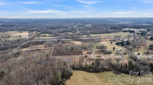 a view of a lake with houses in the back