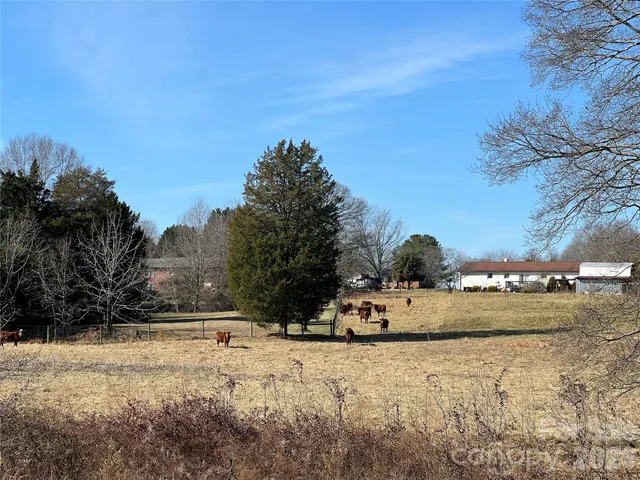 a view of a lake with houses in the back