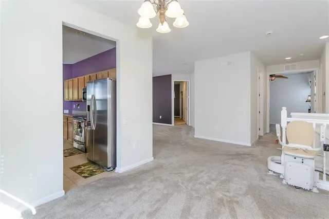 a kitchen with stainless steel appliances granite countertop a sink and cabinets