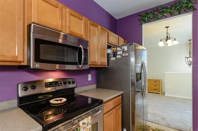 a view of a livingroom with furniture and a window